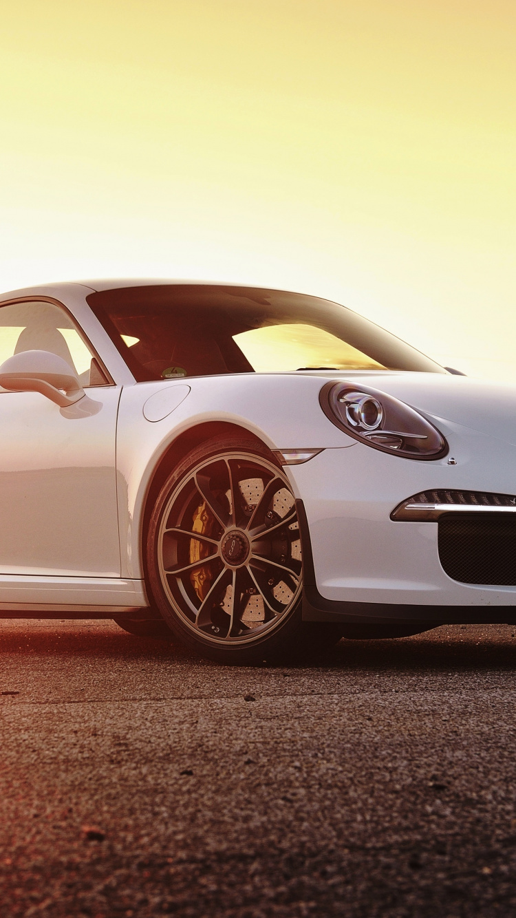 White Porsche 911 on Brown Field. Wallpaper in 750x1334 Resolution