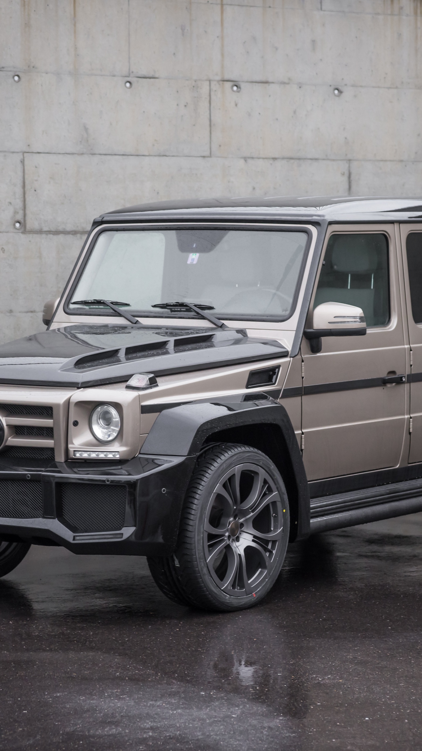 Brown and Black Suv Parked Beside White Wall. Wallpaper in 1440x2560 Resolution