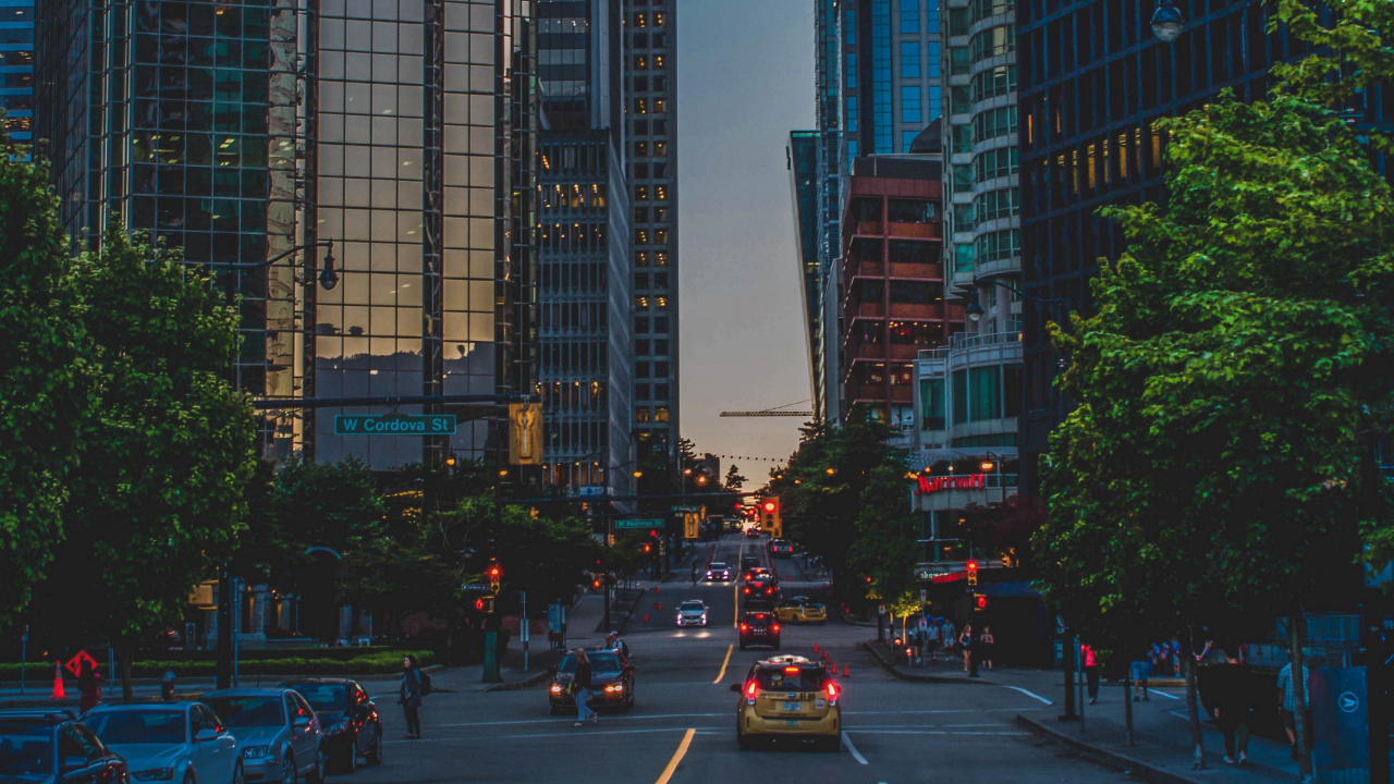 Cars on Road Near High Rise Buildings During Daytime. Wallpaper in 1280x720 Resolution