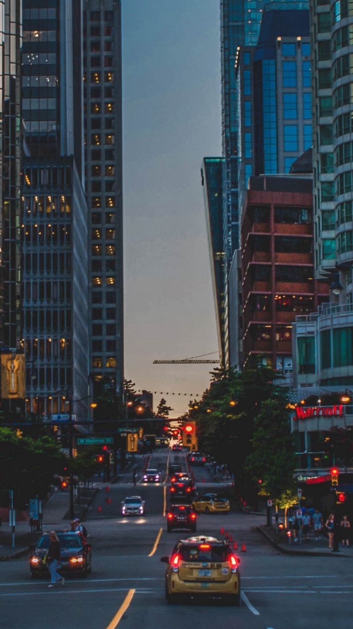 Cars on Road Near High Rise Buildings During Daytime. Wallpaper in 720x1280 Resolution