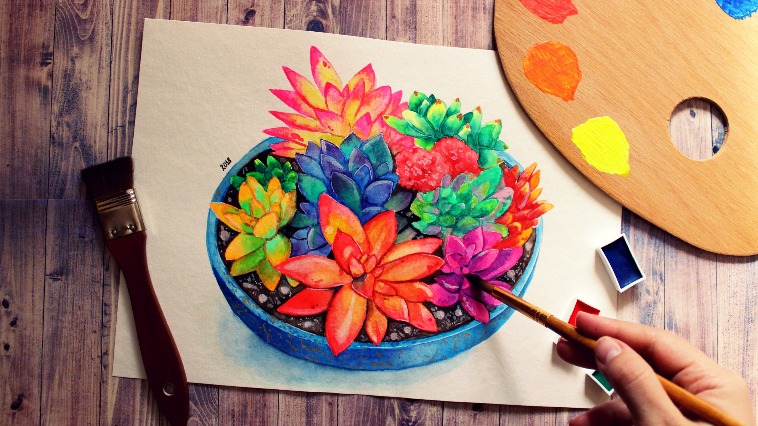 Person Holding Red and Yellow Floral Hand Fan. Wallpaper in 2560x1440 Resolution