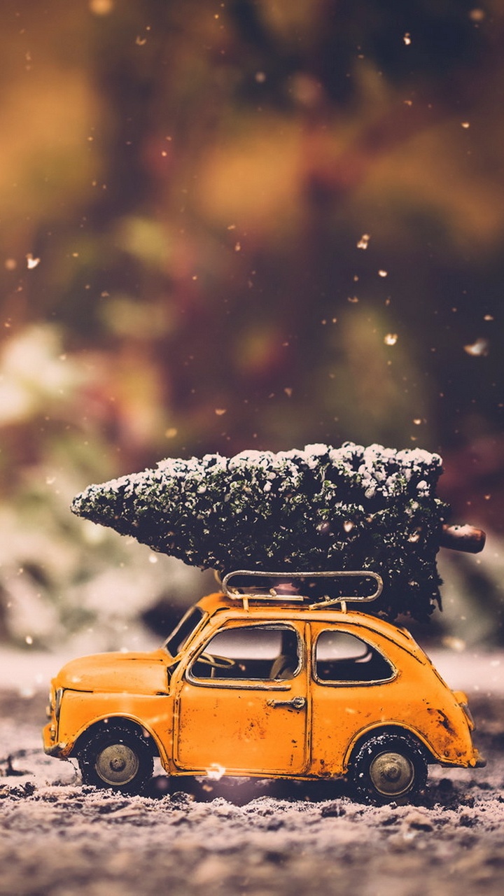 Yellow Car on Snow Covered Ground During Daytime. Wallpaper in 720x1280 Resolution