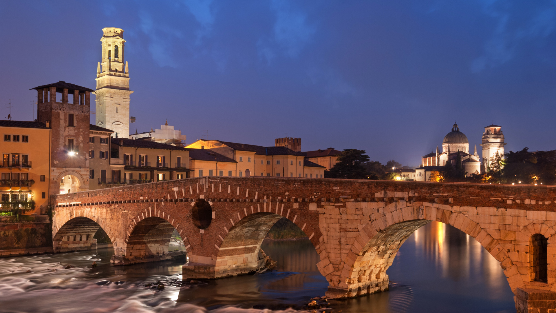 Brown Concrete Bridge Over River During Night Time. Wallpaper in 1920x1080 Resolution