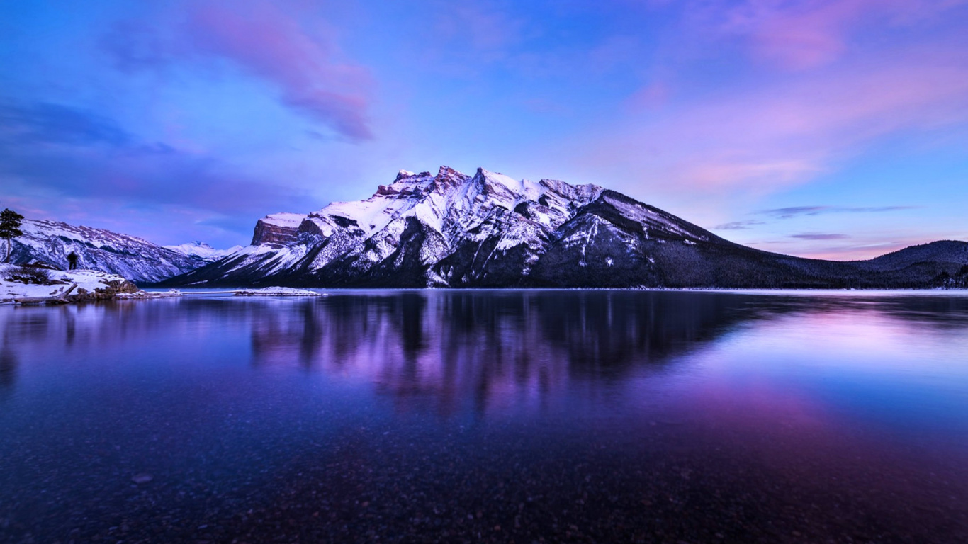 Snow Covered Mountain Near Lake Under Blue Sky During Daytime. Wallpaper in 1366x768 Resolution