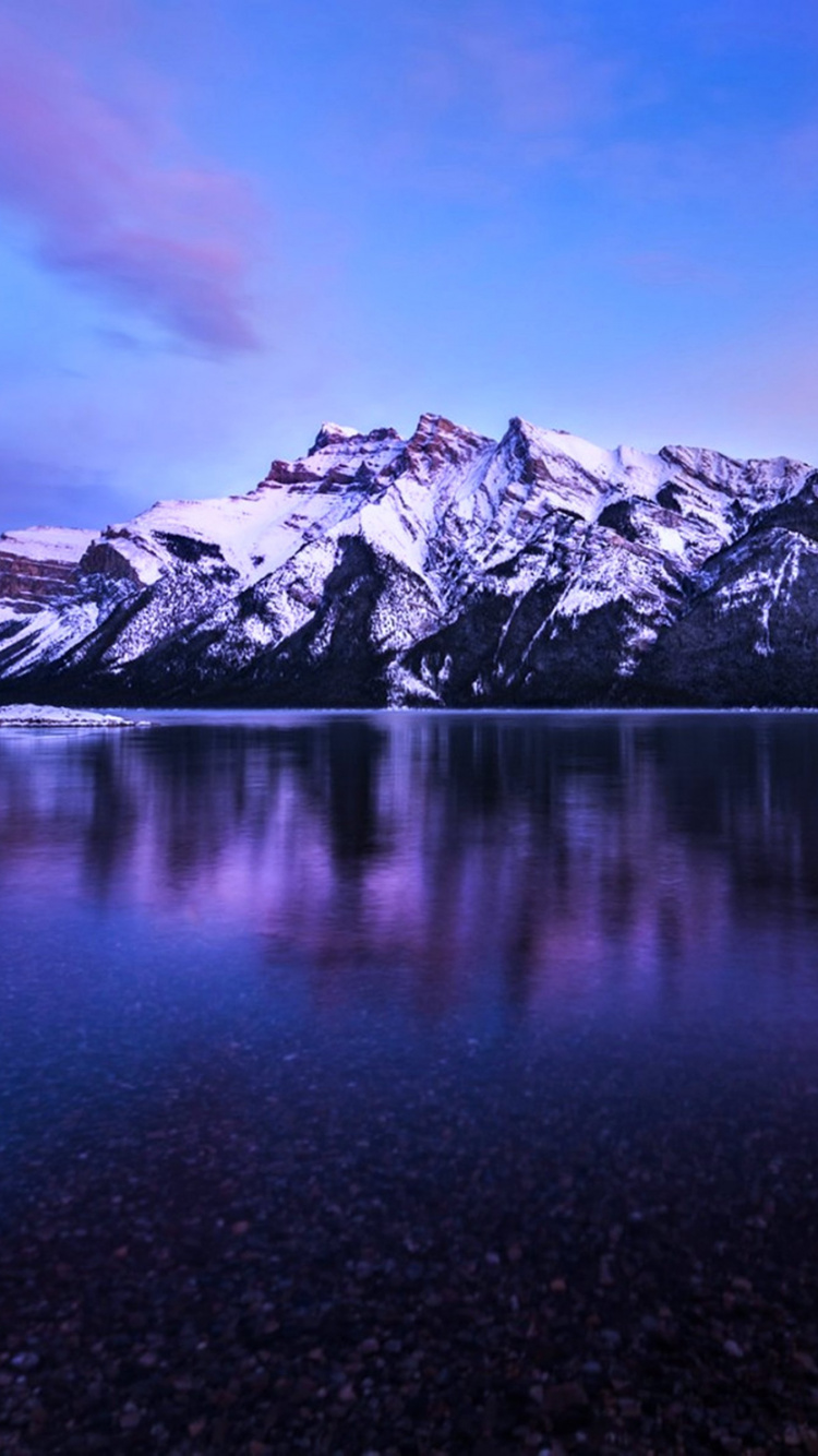 Snow Covered Mountain Near Lake Under Blue Sky During Daytime. Wallpaper in 750x1334 Resolution