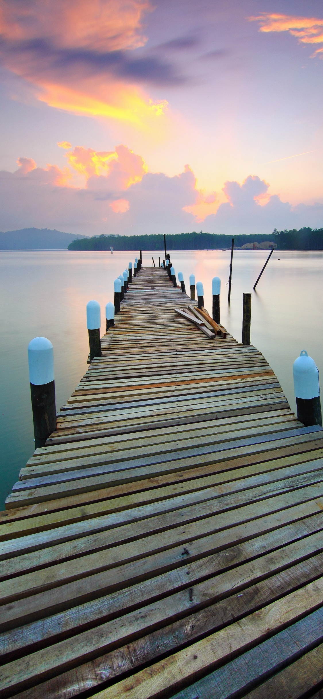 Brown Wooden Dock on Lake During Sunset. Wallpaper in 1125x2436 Resolution