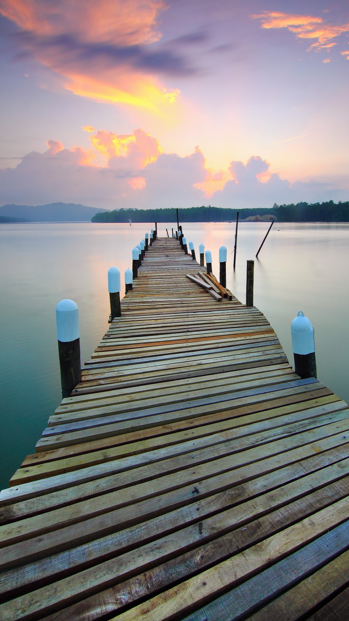 Brown Wooden Dock on Lake During Sunset. Wallpaper in 1440x2560 Resolution