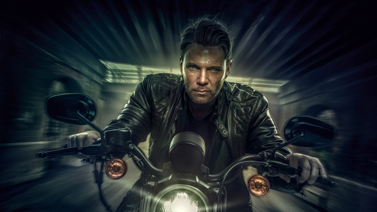 Man in Black Leather Jacket Riding Motorcycle. Wallpaper in 1280x720 Resolution