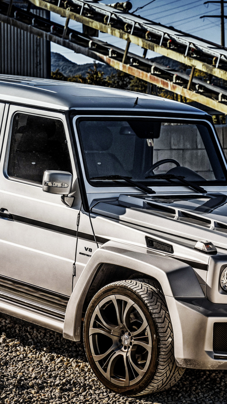 Grey Suv on Grey Concrete Road During Daytime. Wallpaper in 750x1334 Resolution