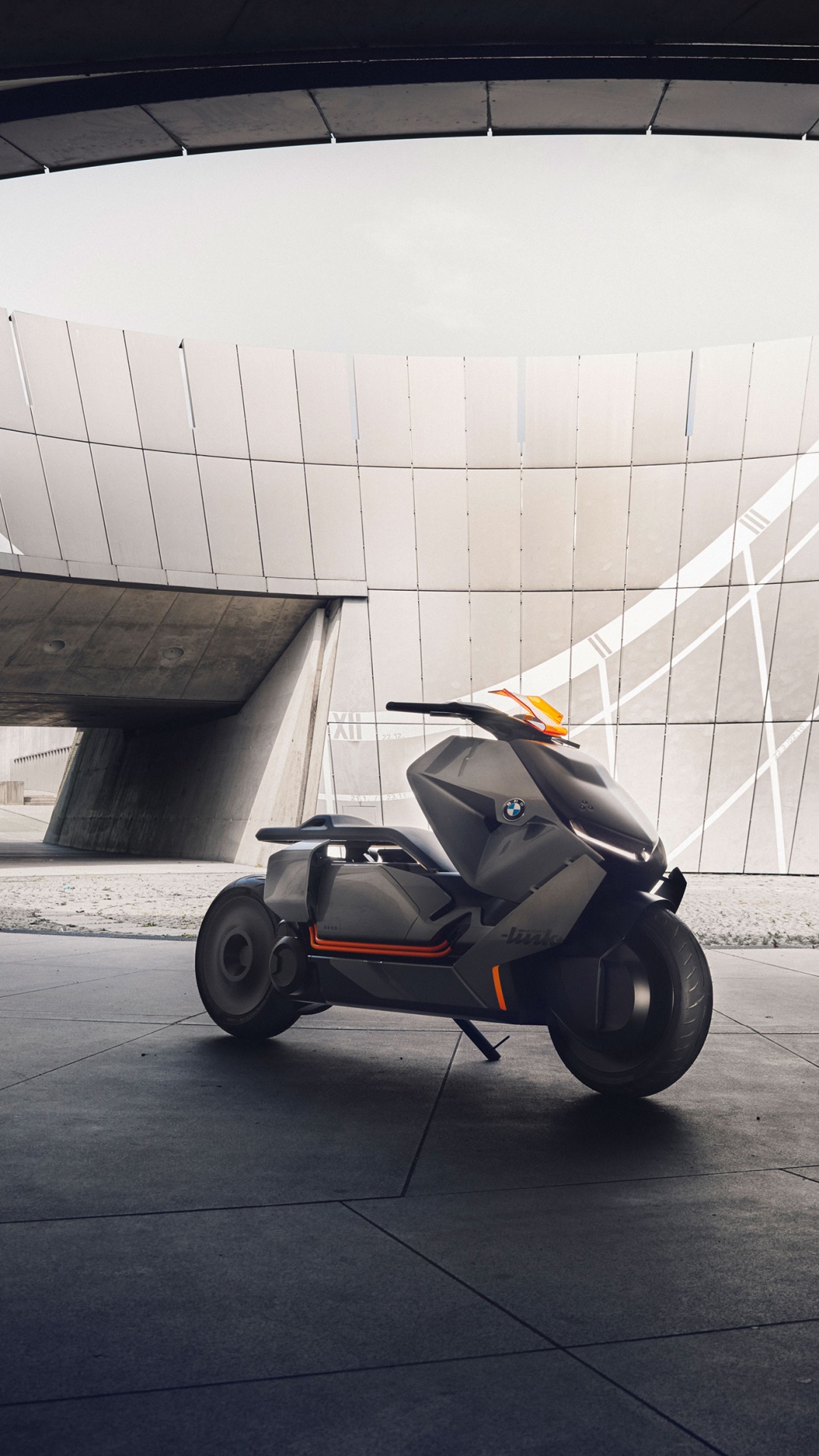 Black and Orange Stroller on Gray Concrete Floor. Wallpaper in 1080x1920 Resolution