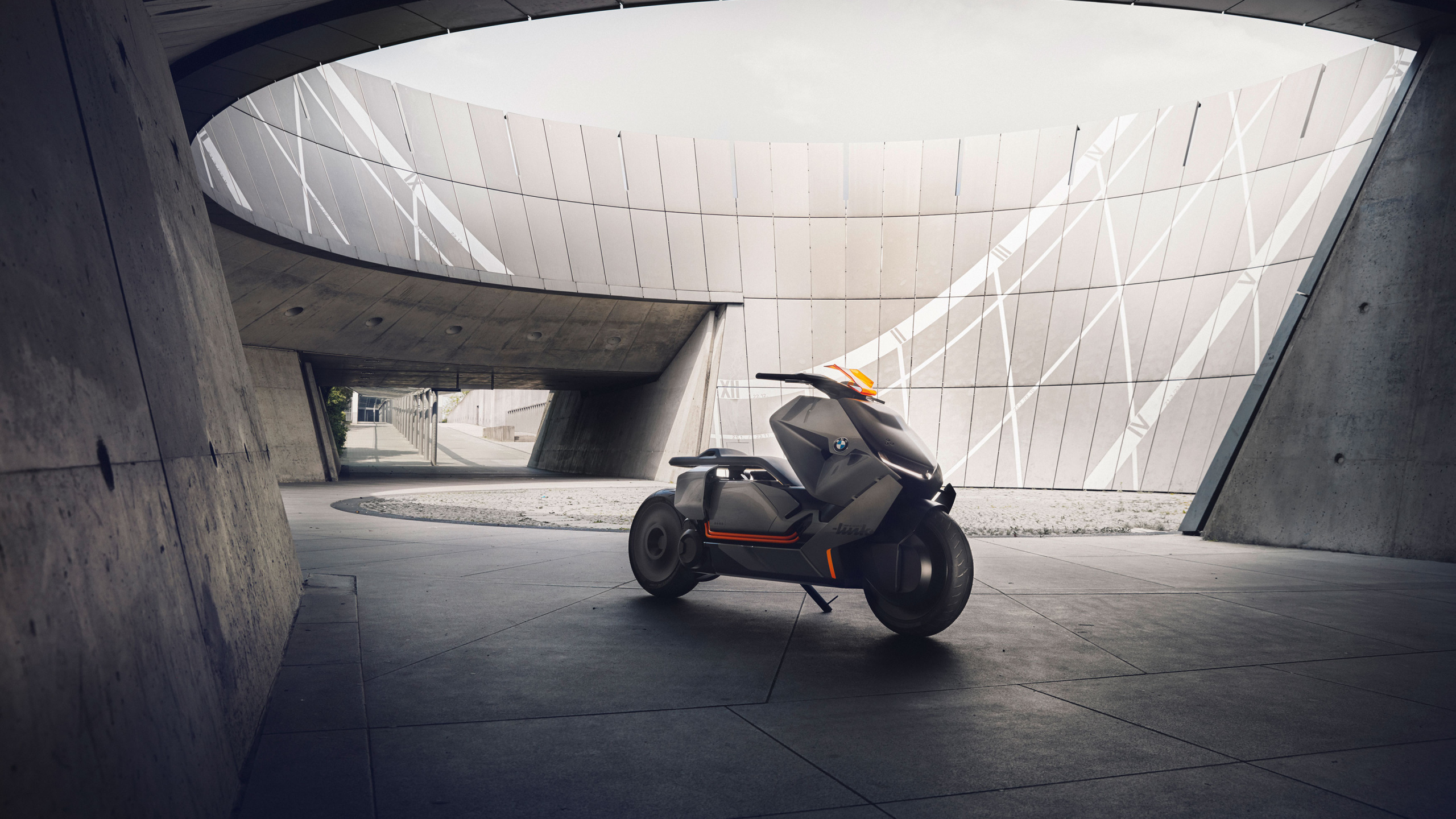 Black and Orange Stroller on Gray Concrete Floor. Wallpaper in 2560x1440 Resolution