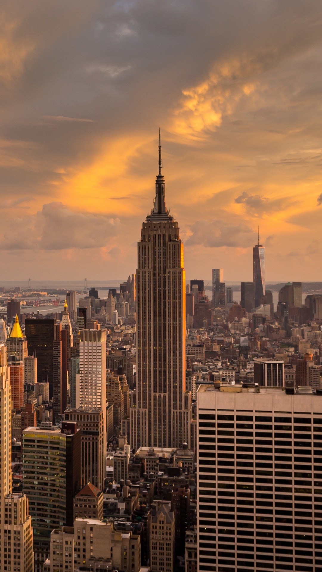 City Skyline Under Cloudy Sky During Sunset. Wallpaper in 1080x1920 Resolution