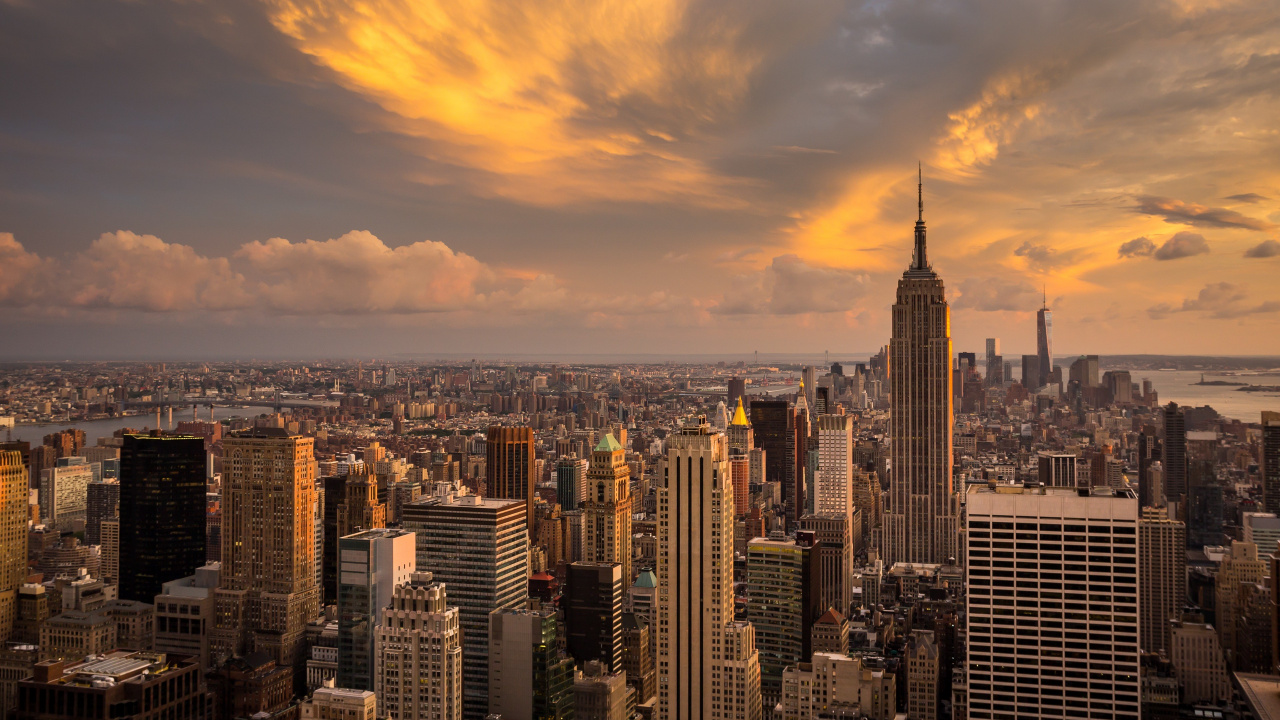 City Skyline Under Cloudy Sky During Sunset. Wallpaper in 1280x720 Resolution