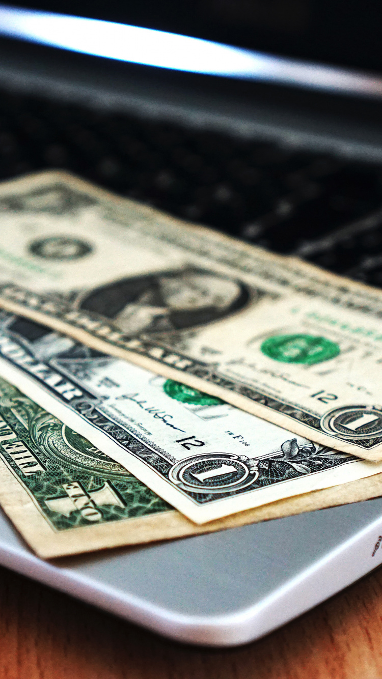 1 us Dollar Bill on Macbook Pro. Wallpaper in 750x1334 Resolution