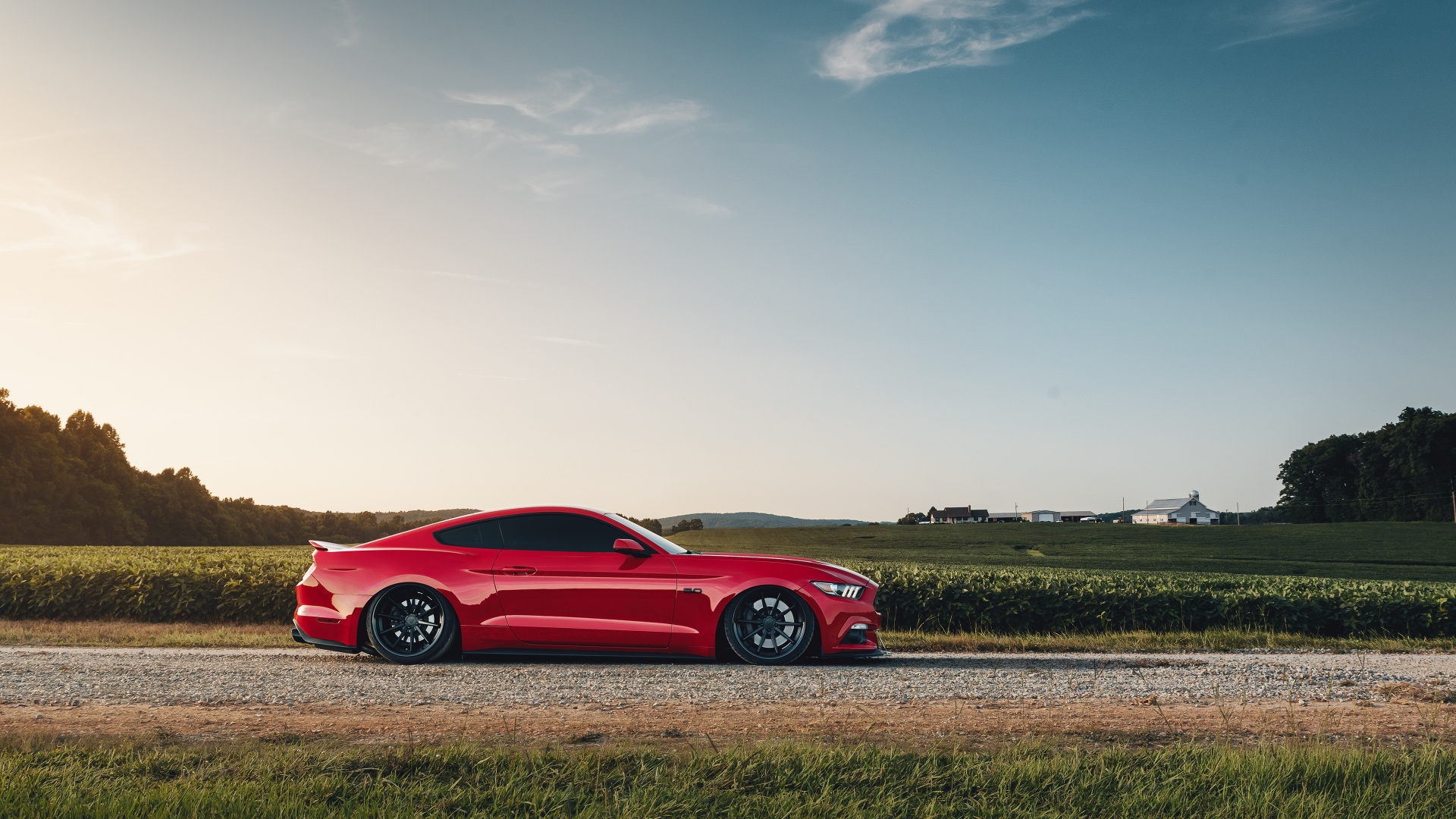 Red Ferrari Coupe on Brown Field Under Blue Sky During Daytime. Wallpaper in 1920x1080 Resolution