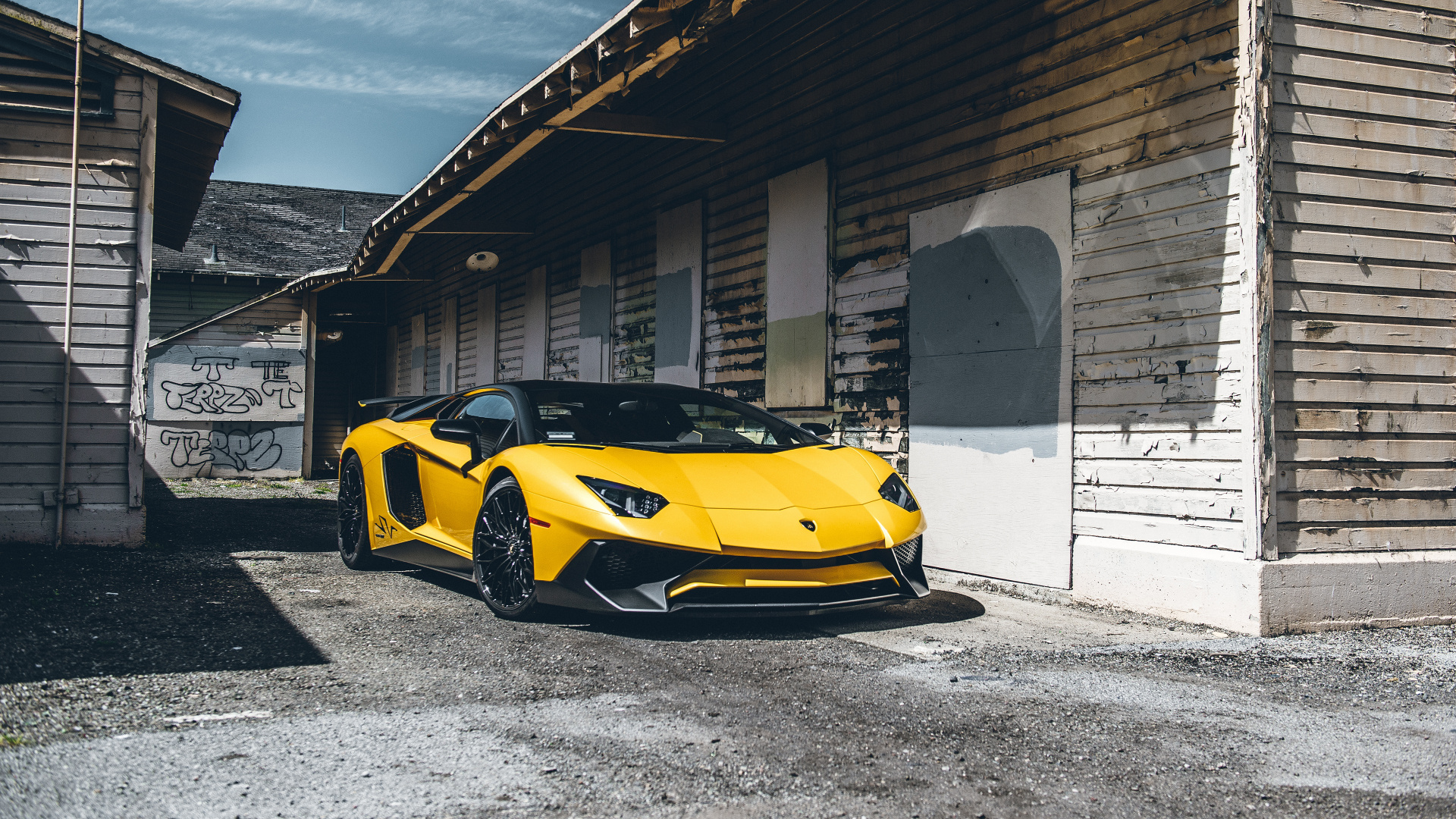 Yellow Lamborghini Aventador Parked Near Building During Daytime. Wallpaper in 1920x1080 Resolution