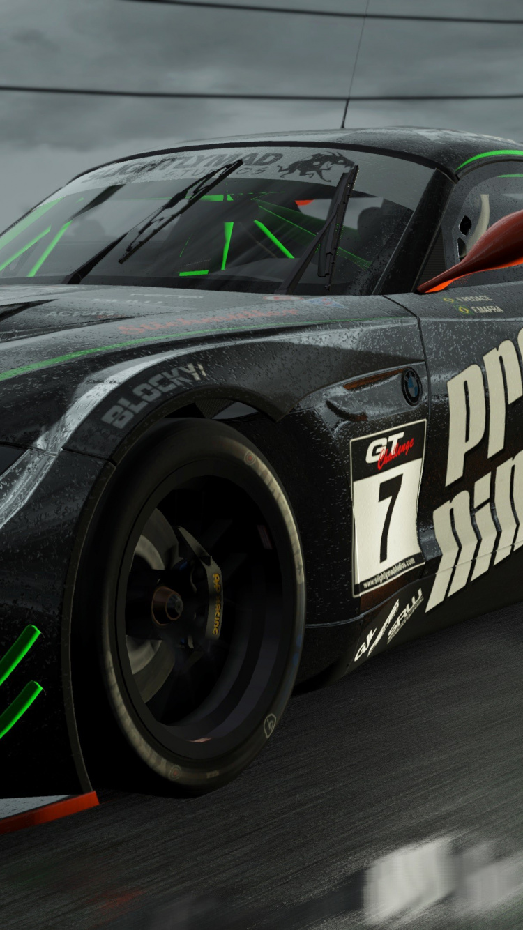 Green and Black Sports Car on Track Field. Wallpaper in 750x1334 Resolution