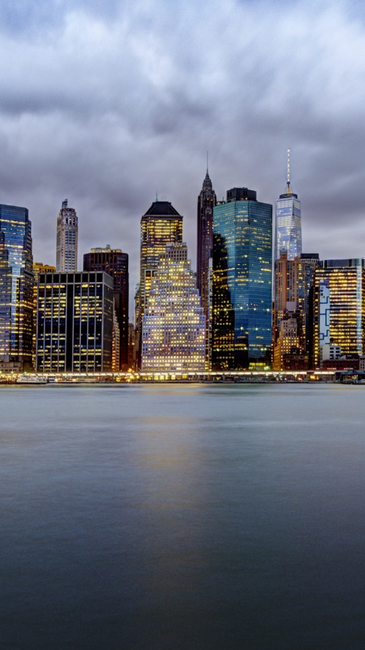 City Skyline Under Cloudy Sky During Daytime. Wallpaper in 750x1334 Resolution