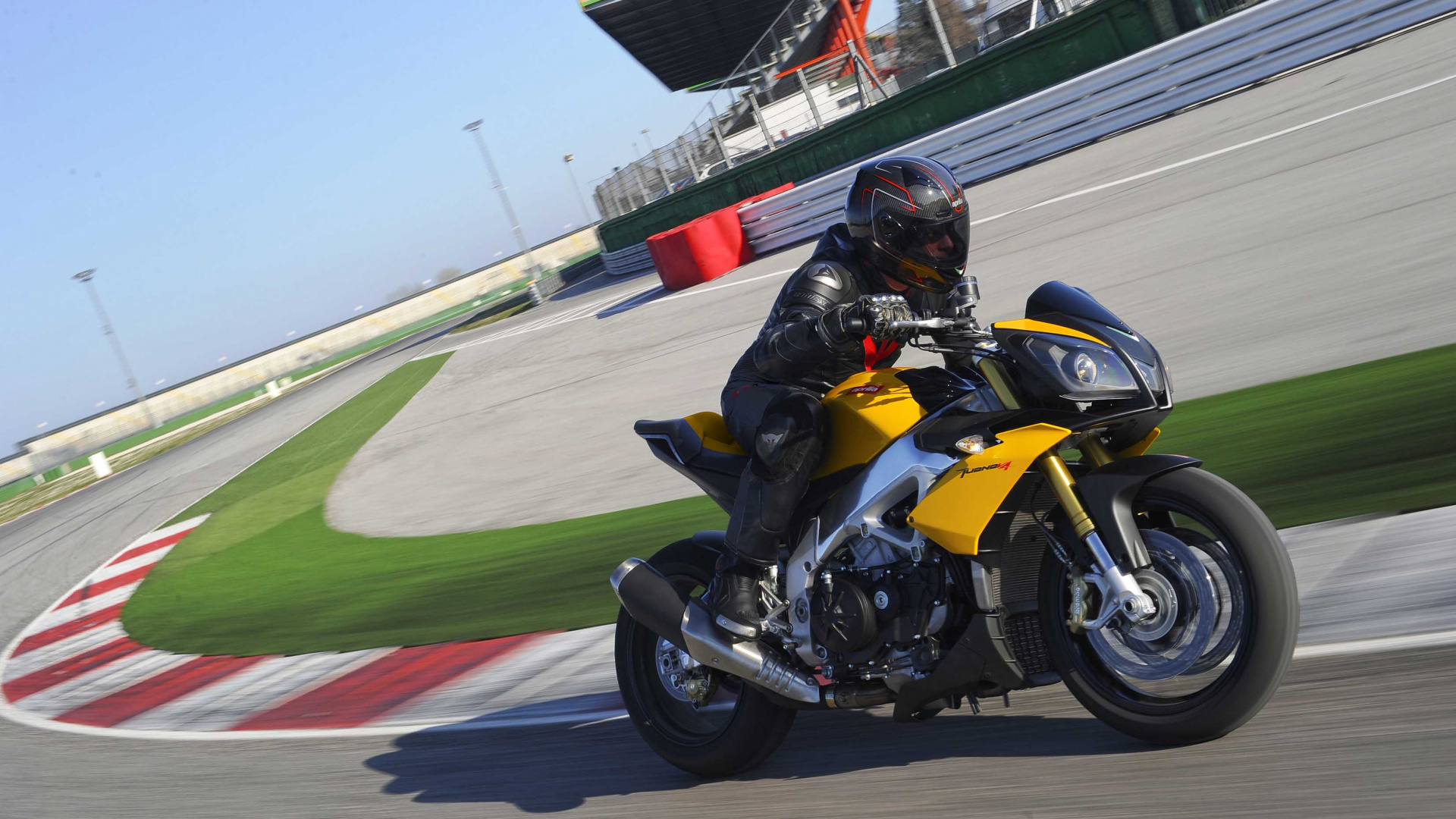 Man in Black Helmet Riding on Sports Bike on Track Field During Daytime. Wallpaper in 1920x1080 Resolution