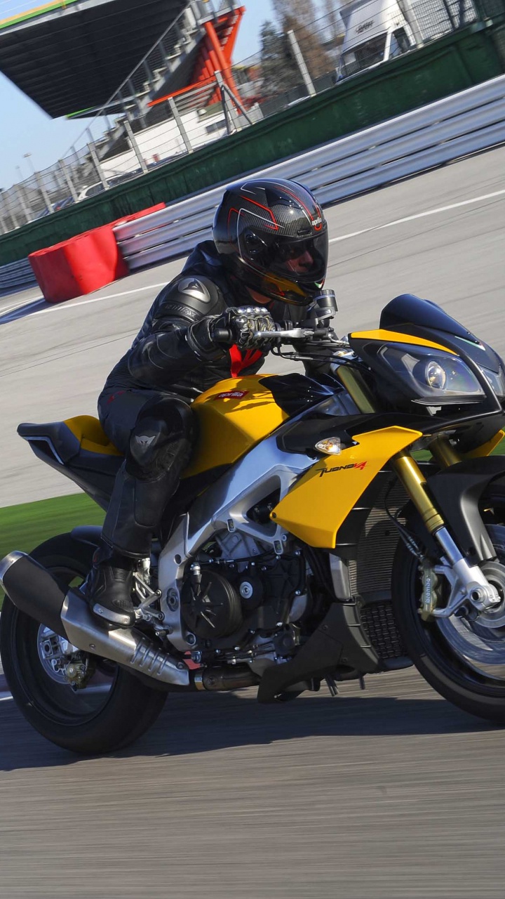 Man in Black Helmet Riding on Sports Bike on Track Field During Daytime. Wallpaper in 720x1280 Resolution