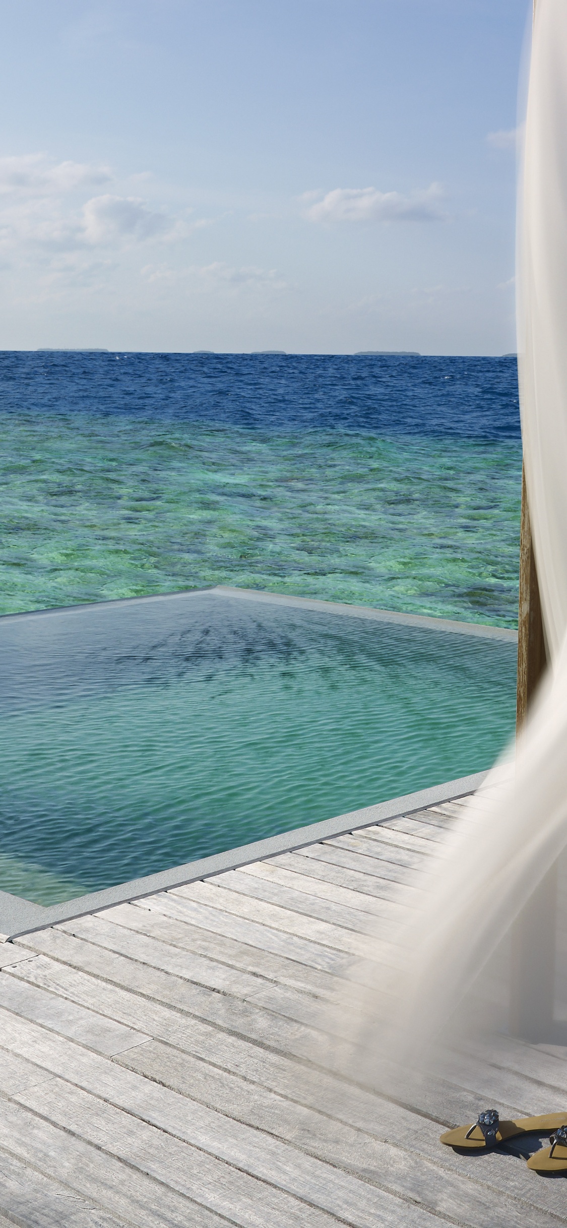 Barco Blanco y Azul en el Mar Durante el Día. Wallpaper in 1125x2436 Resolution