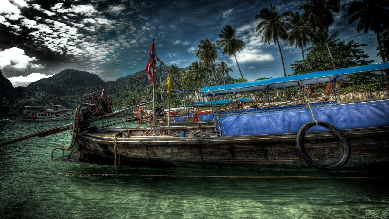 Brown Wooden Boat on Water Near Mountain Under Cloudy Sky During Daytime. Wallpaper in 1280x720 Resolution