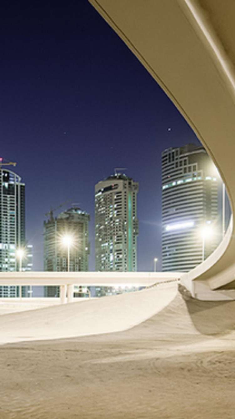 White Concrete Building During Nighttime. Wallpaper in 750x1334 Resolution