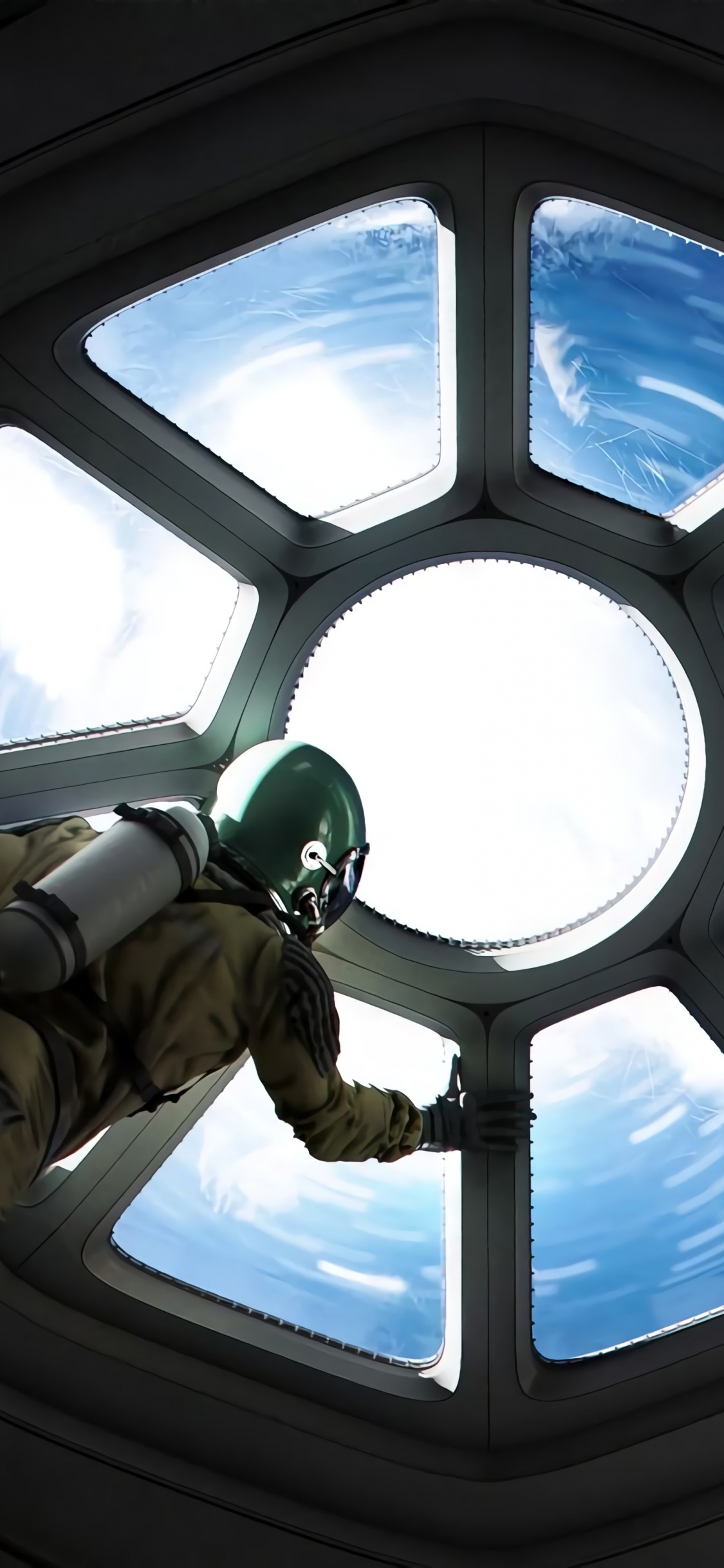 Mann in Brauner Und Schwarzer Jacke Und Hose im Flugzeug. Wallpaper in 1125x2436 Resolution