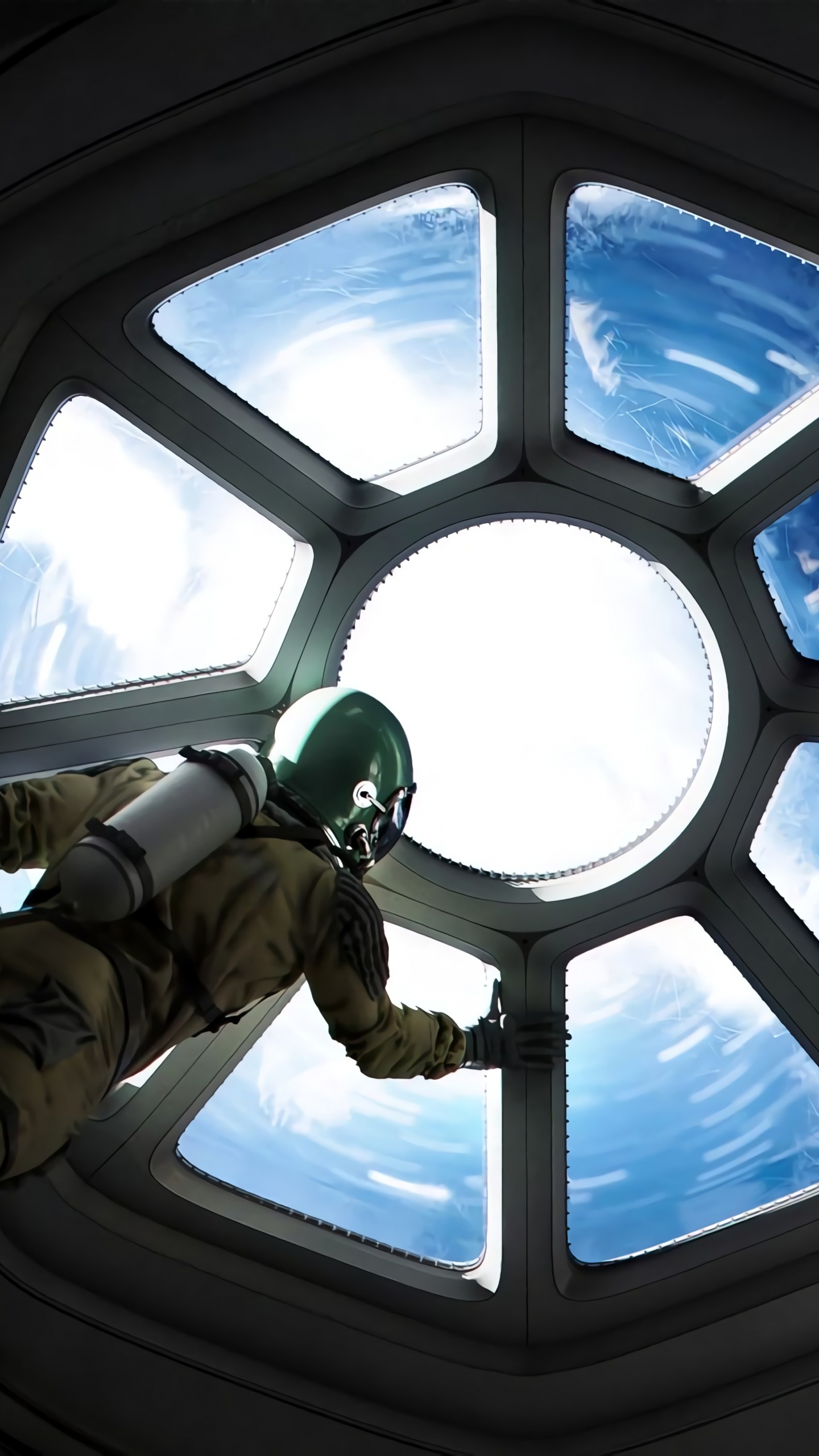 Mann in Brauner Und Schwarzer Jacke Und Hose im Flugzeug. Wallpaper in 1440x2560 Resolution