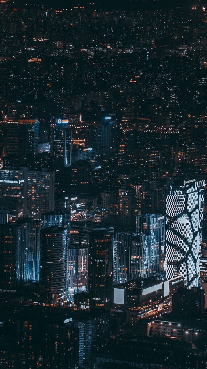 Luftaufnahme Von Stadtgebäuden Während Der Nacht. Wallpaper in 720x1280 Resolution