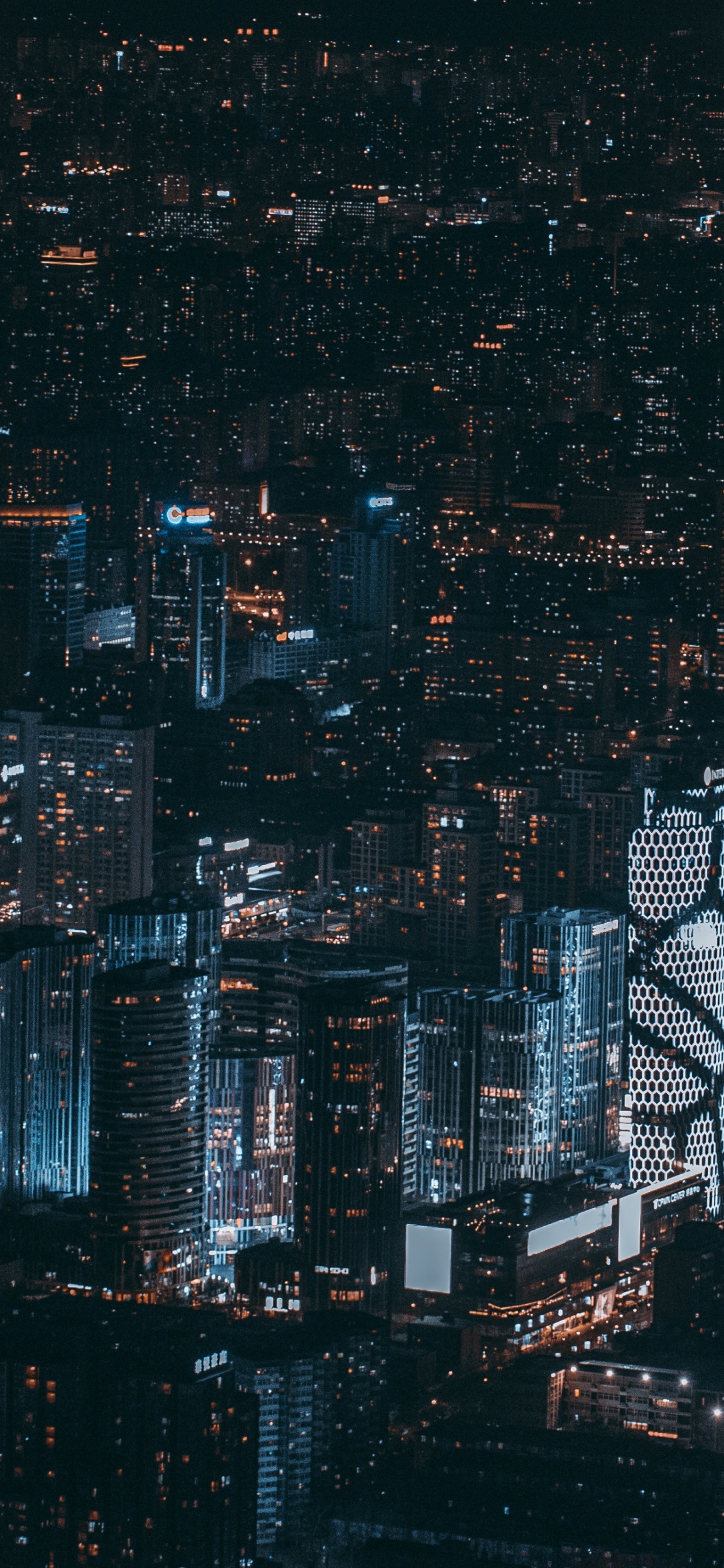 Aerial View of City Buildings During Night Time. Wallpaper in 1242x2688 Resolution