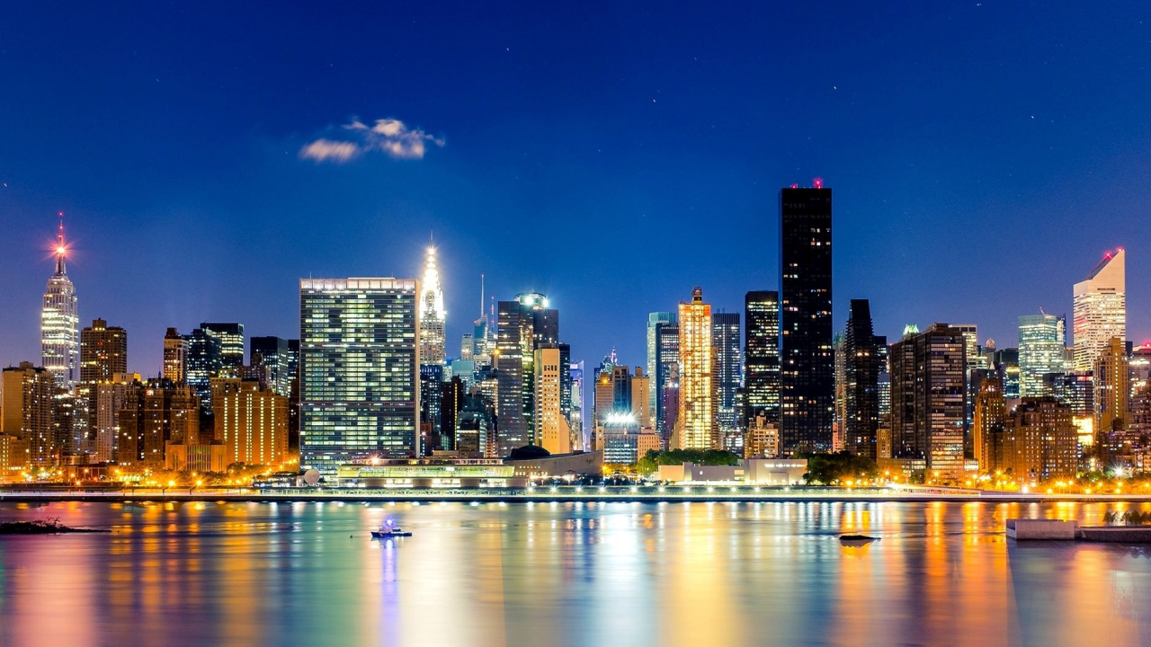 City Skyline Across Body of Water During Night Time. Wallpaper in 1280x720 Resolution