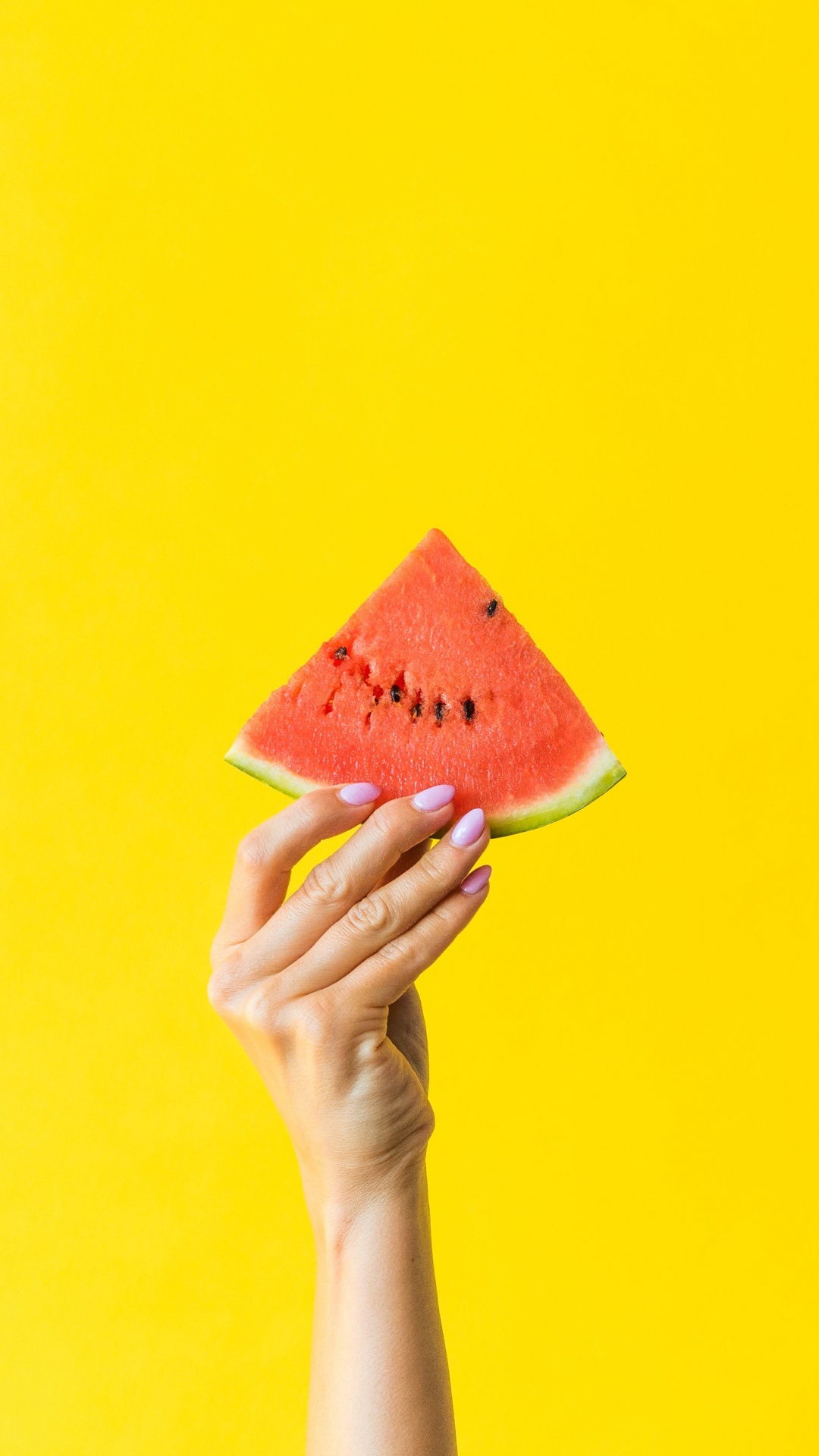 Person Holding Orange and Yellow Cone. Wallpaper in 1080x1920 Resolution