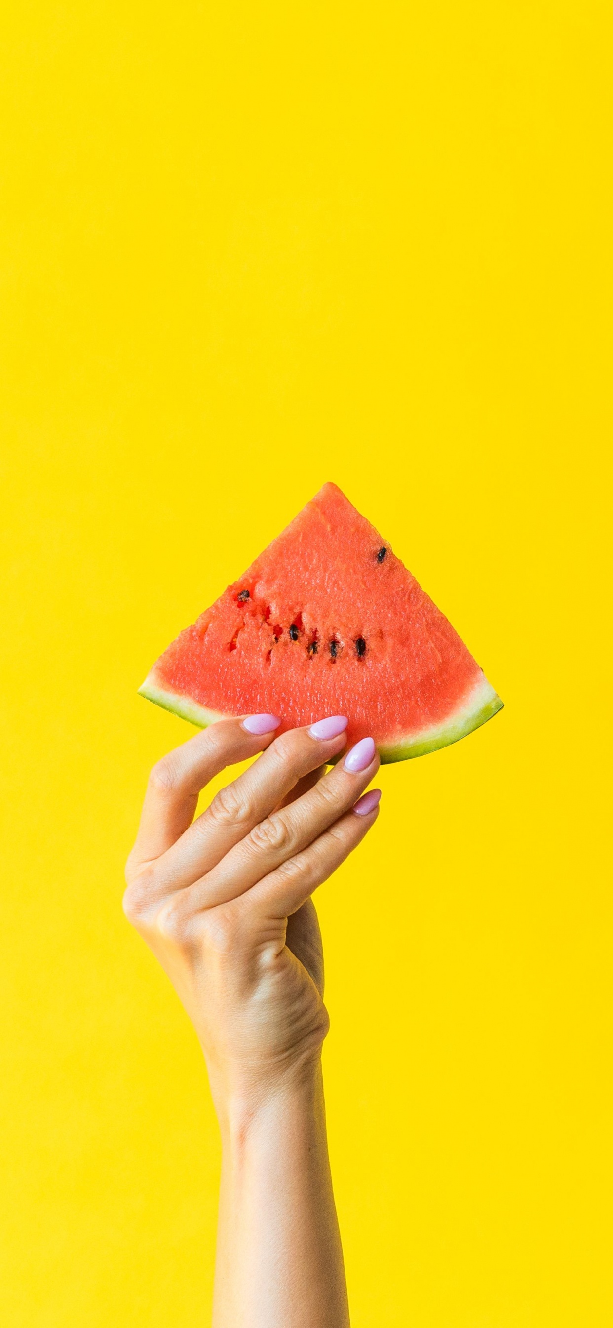 Person Holding Orange and Yellow Cone. Wallpaper in 1242x2688 Resolution