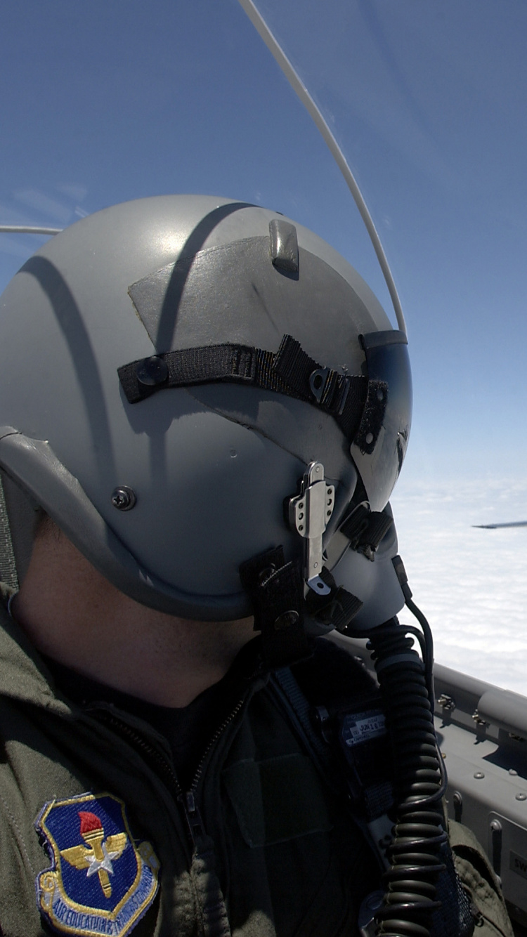 Person in Black Jacket Wearing White Helmet. Wallpaper in 750x1334 Resolution