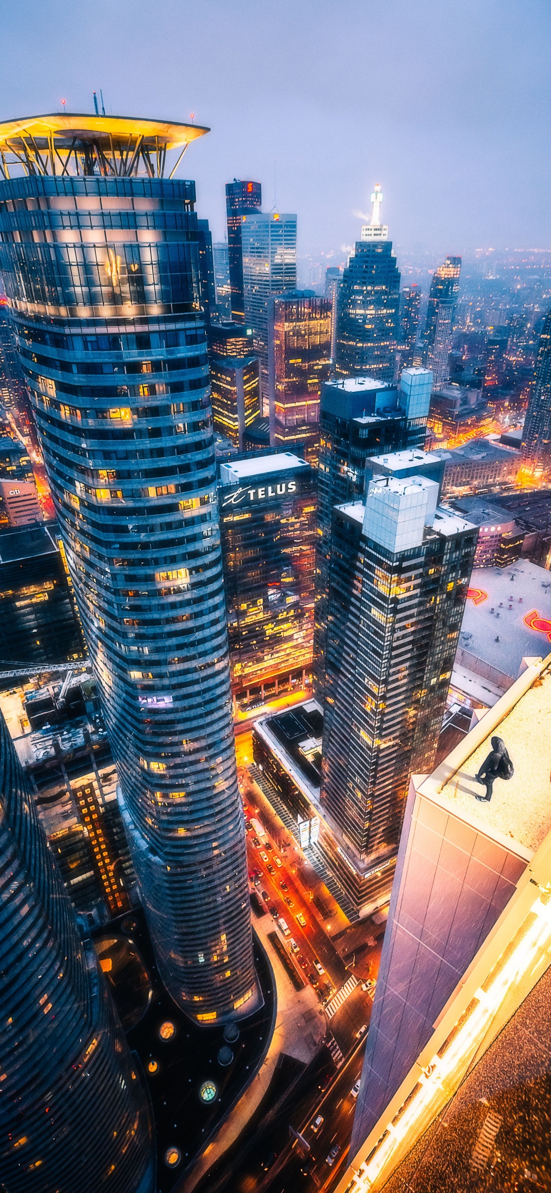 Aerial View of City Buildings During Night Time. Wallpaper in 1125x2436 Resolution