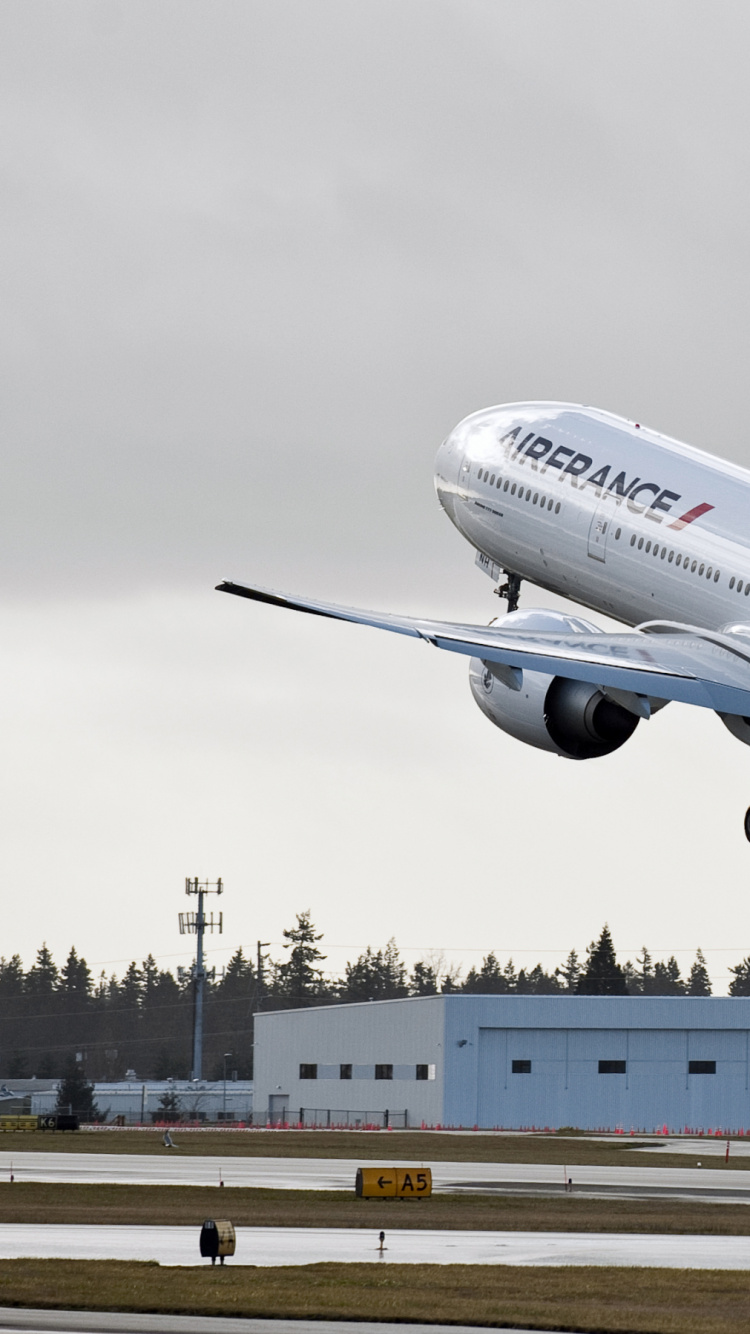 White and Red Passenger Plane on Airport During Daytime. Wallpaper in 750x1334 Resolution