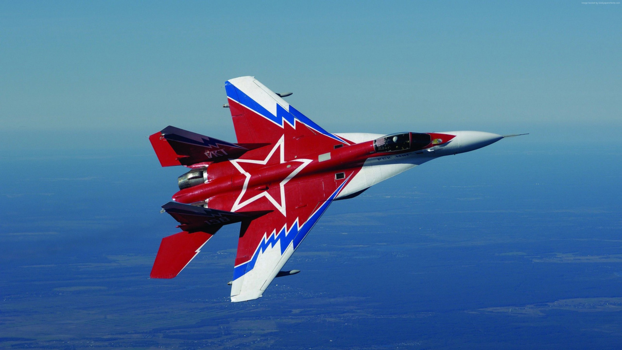 Red and White Jet Plane Flying Over Blue Sky During Daytime. Wallpaper in 1280x720 Resolution