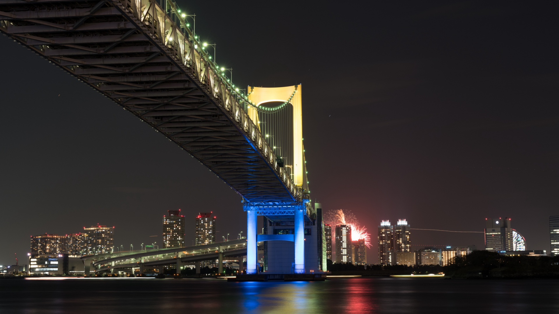 Lighted Bridge Over Water During Night Time. Wallpaper in 1920x1080 Resolution