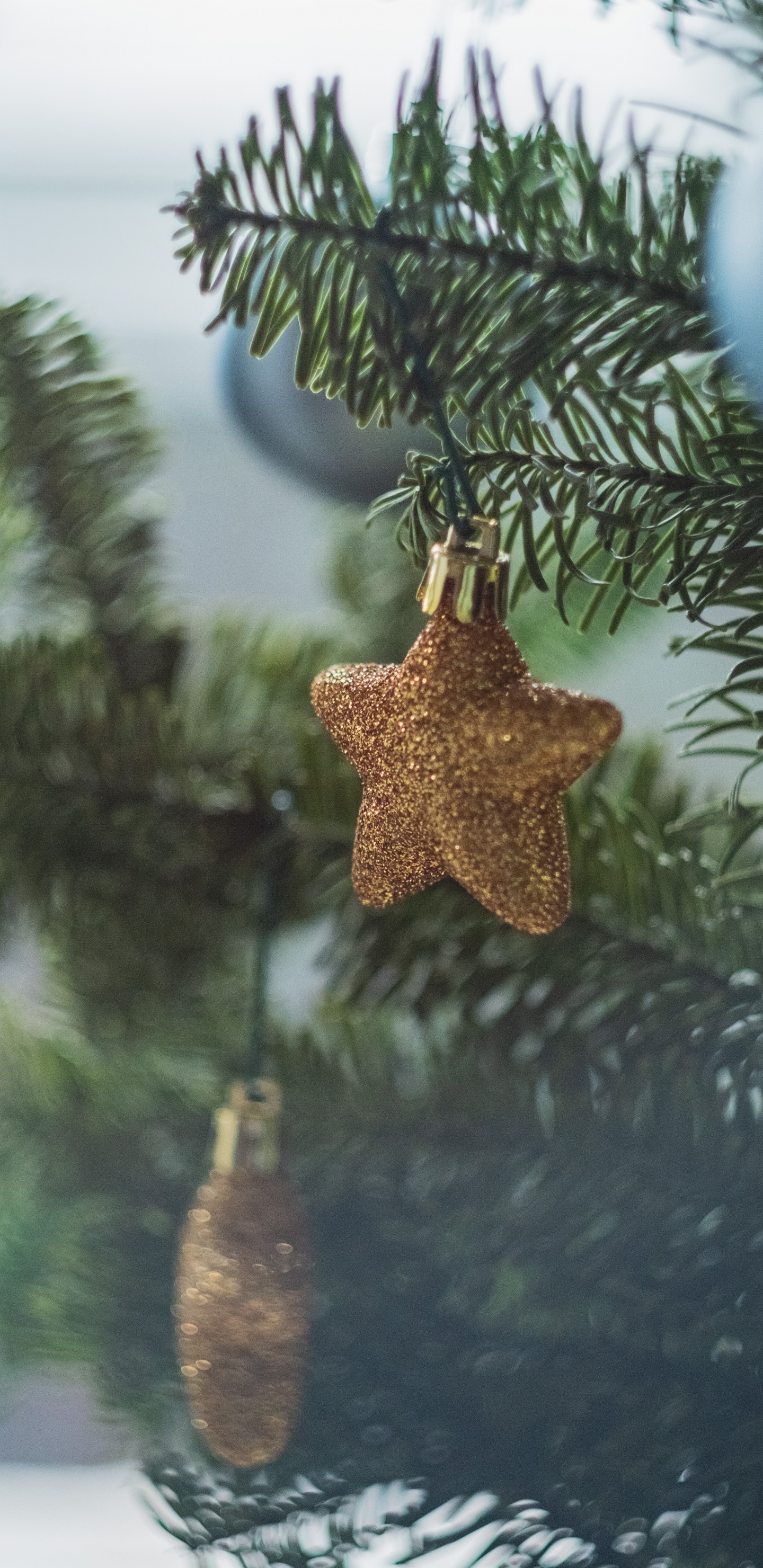 Gold Angel Ornament on Green Pine Tree. Wallpaper in 1440x2960 Resolution