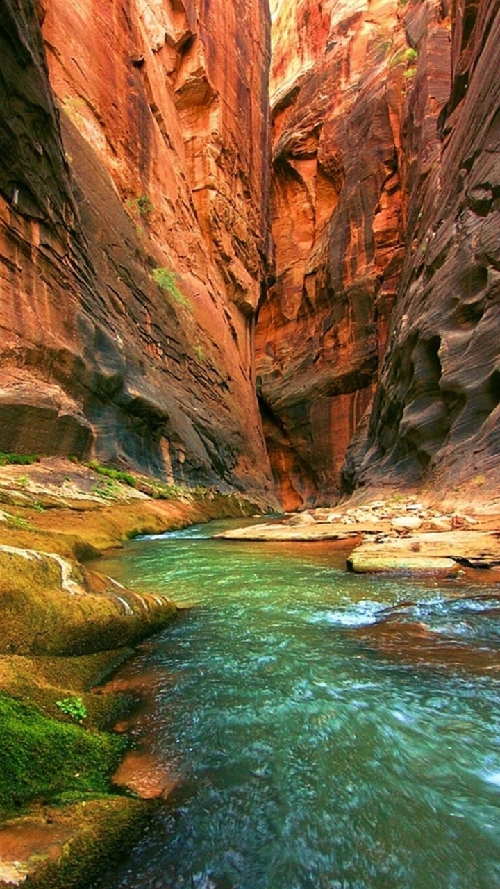 Brown Rocky Mountain Beside River During Daytime. Wallpaper in 720x1280 Resolution