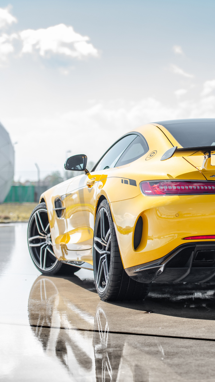 Yellow Chevrolet Camaro on Road During Daytime. Wallpaper in 750x1334 Resolution