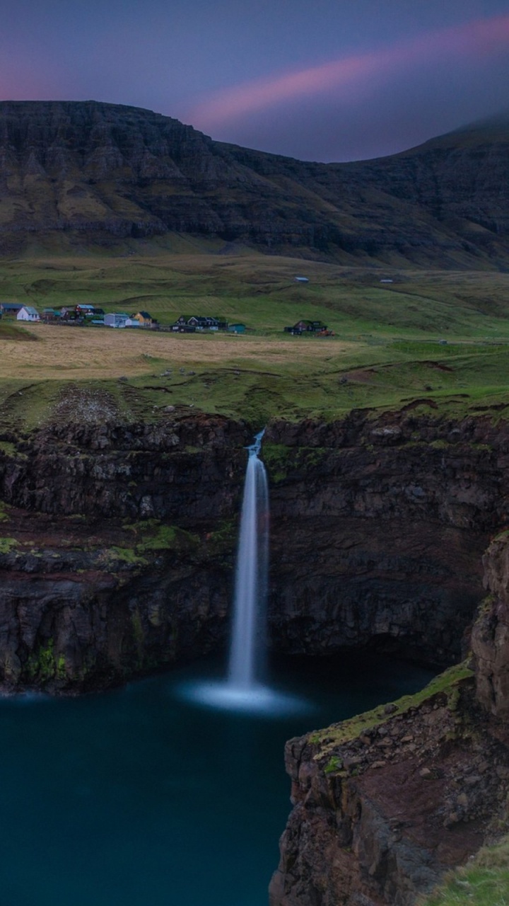 Green and Brown Mountain Beside Body of Water During Daytime. Wallpaper in 720x1280 Resolution