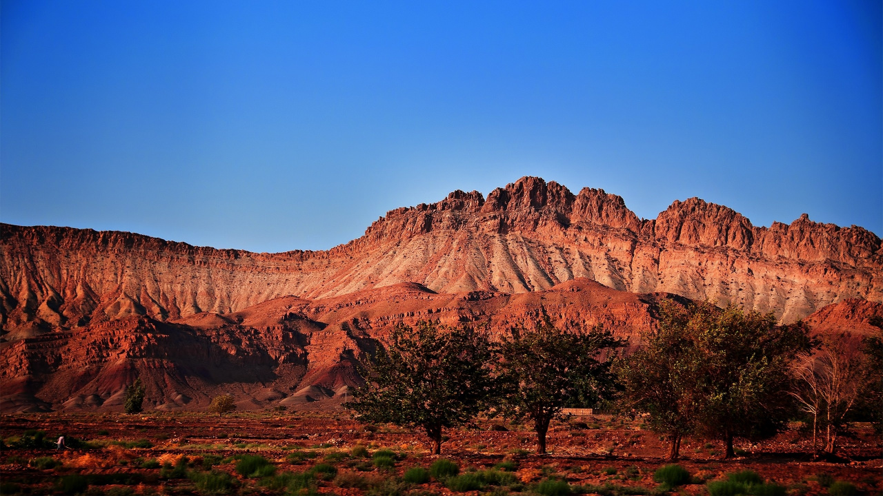 Brown Rocky Mountain Under Blue Sky During Daytime. Wallpaper in 1280x720 Resolution