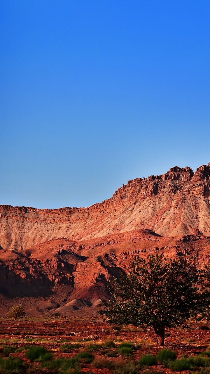 Brown Rocky Mountain Under Blue Sky During Daytime. Wallpaper in 720x1280 Resolution