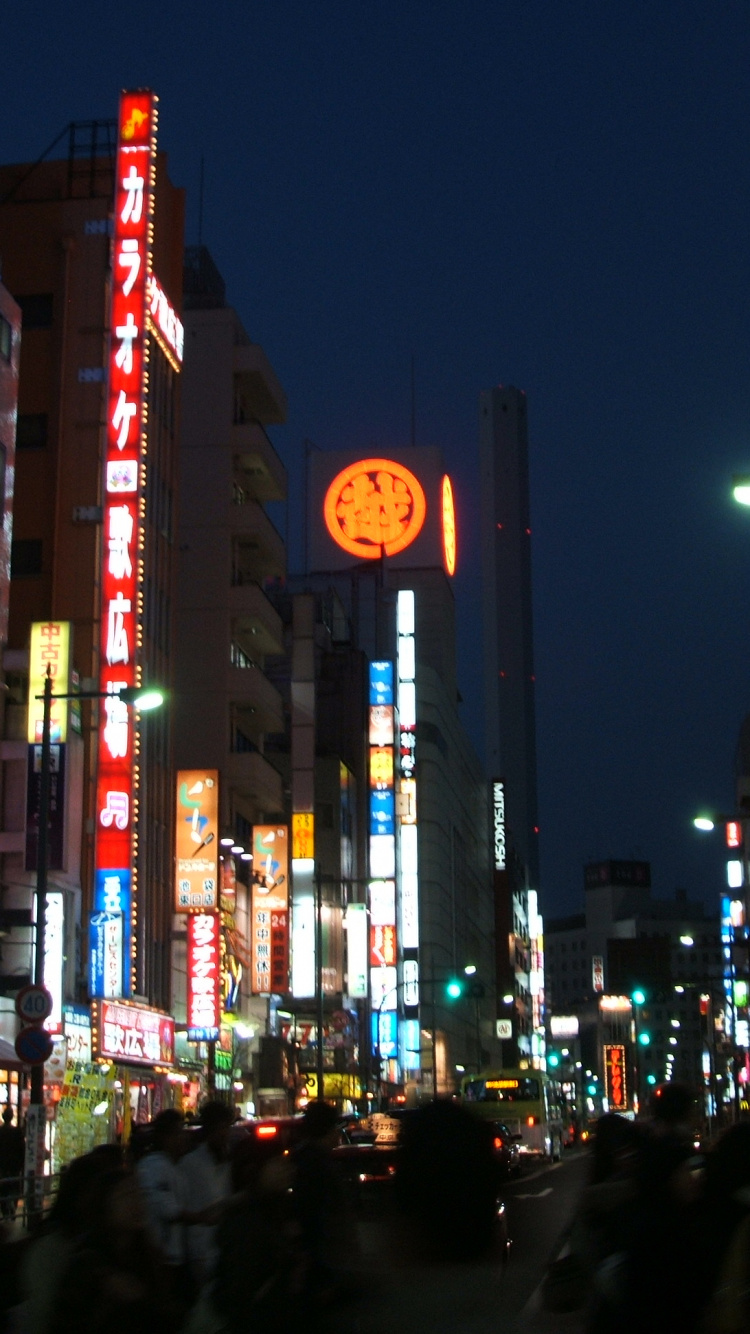 Cars Parked on Side of The Road in City During Night Time. Wallpaper in 750x1334 Resolution