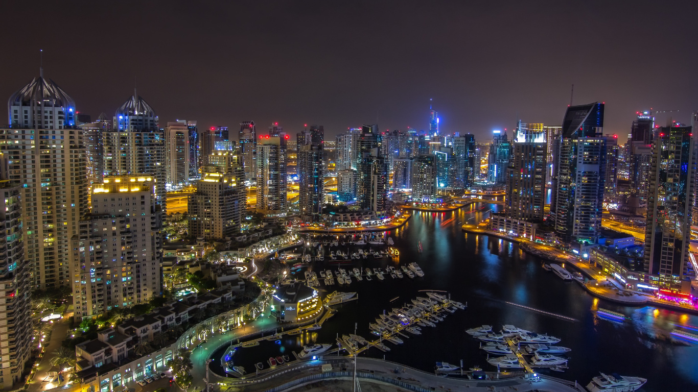 City With High Rise Buildings During Night Time. Wallpaper in 1366x768 Resolution