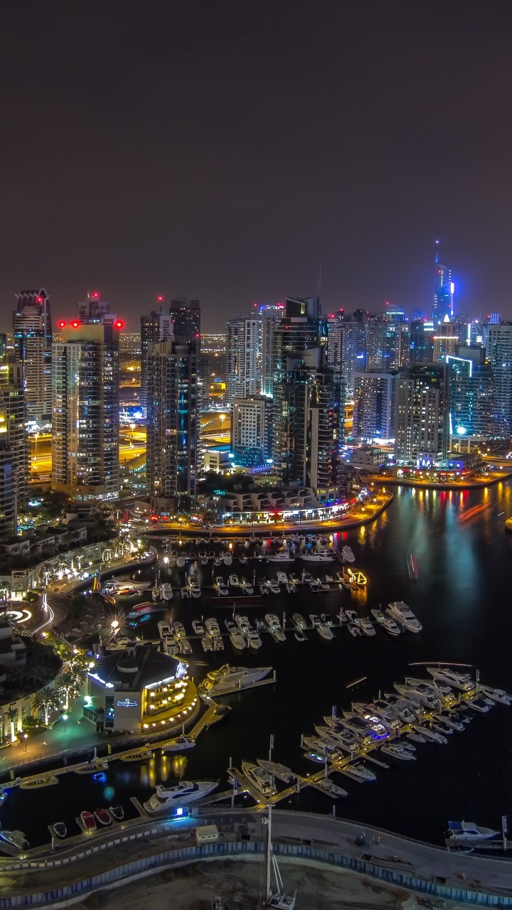 City With High Rise Buildings During Night Time. Wallpaper in 720x1280 Resolution