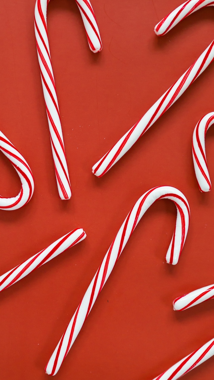Red and White Candy Canes. Wallpaper in 720x1280 Resolution