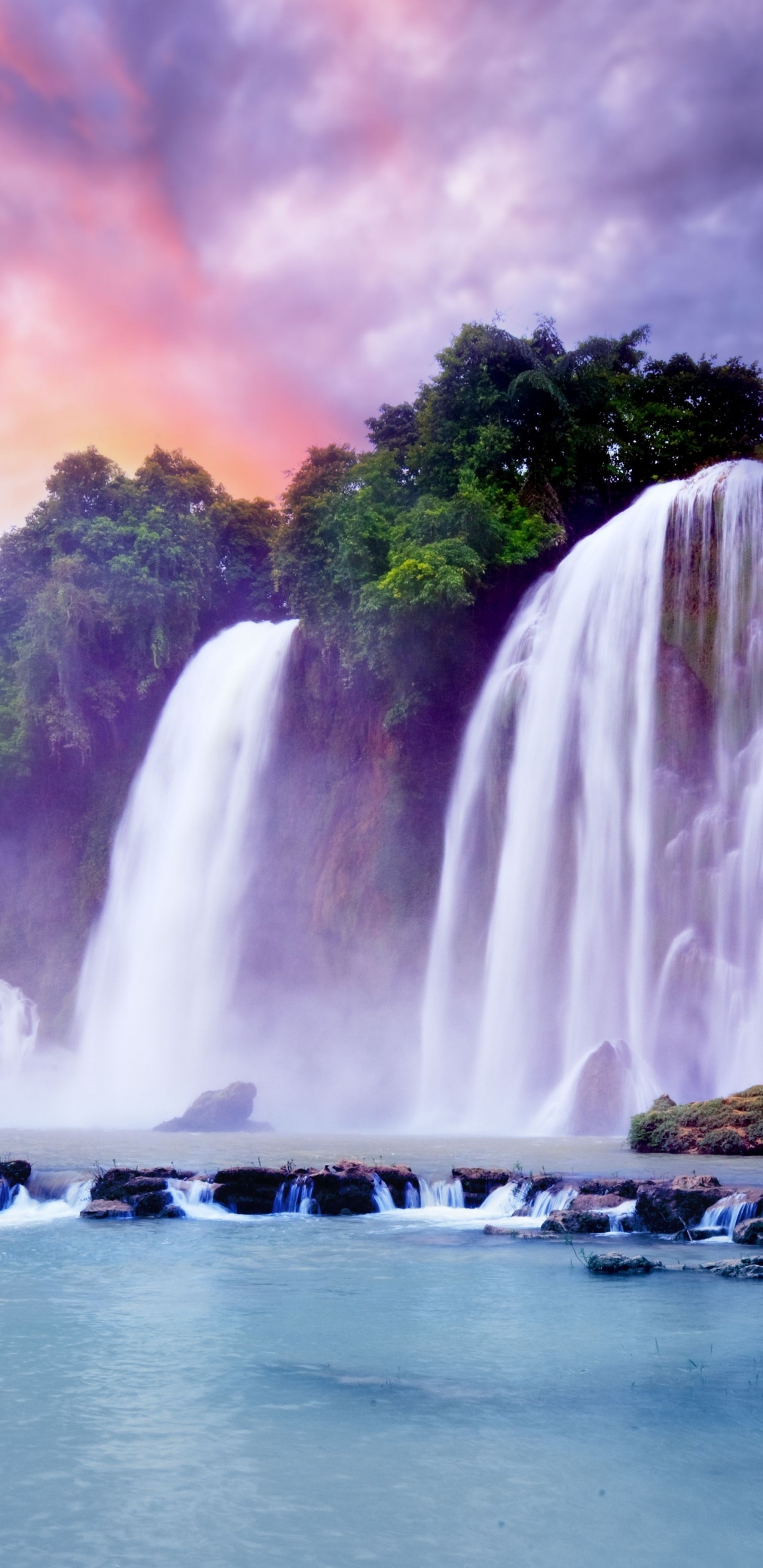 Waterfalls Near Green Trees Under Cloudy Sky During Daytime. Wallpaper in 1440x2960 Resolution